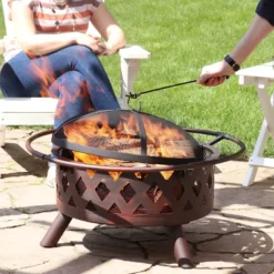 Sunnydaze Decor Sunnydaze Outdoor Camping Or Backyard Crossweave Cut Out Fire Pit With Spark Screen, Log Poker, And Metal Wood Grate - Bronze -Sunnydaze Decor GUEST a8fcb32a ec37 4322 bea9 015441fcd73f