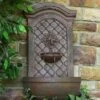 Sunnydaze Decor Sunnydaze 31"H Solar-Powered With Battery Pack Polystone Rosette Leaf Outdoor Wall-Mount Fountain